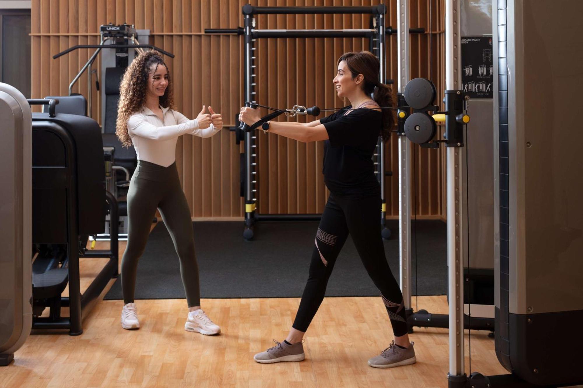 Hyatt Regency Riyadh Olaya Екстериор снимка Personal trainer working with a female client